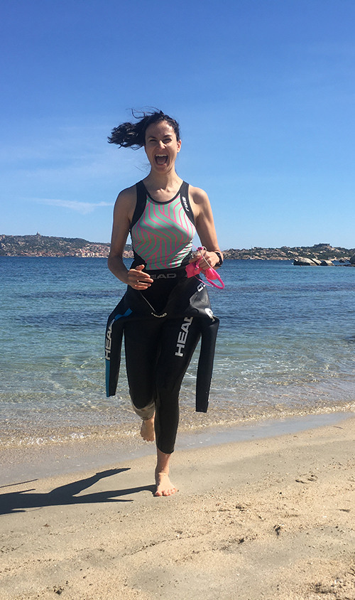 running with wetsuit at sea